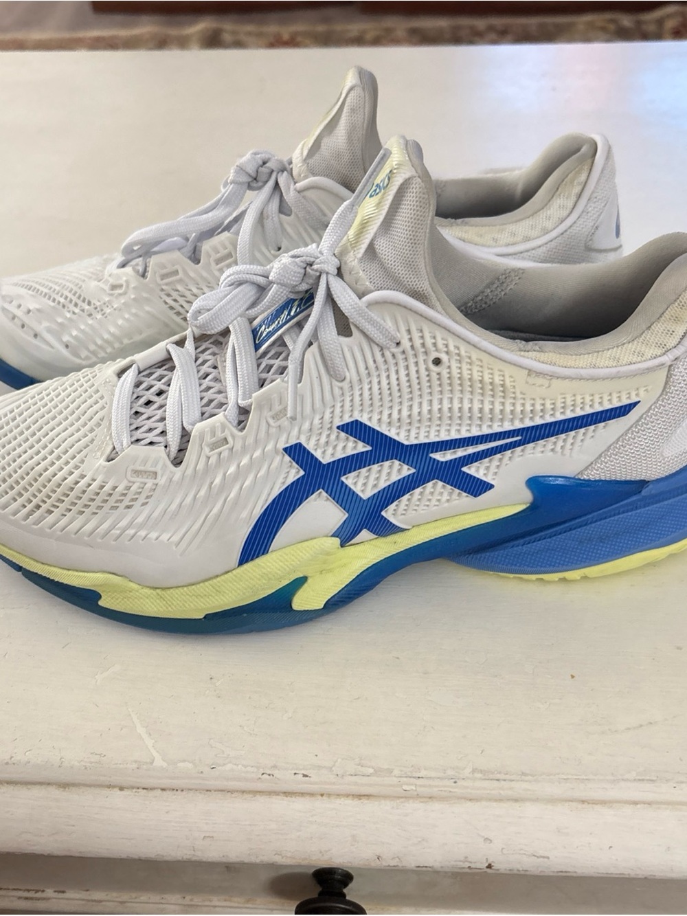 Asics White Athletic Shoes with Blue Accents and Yellow Midsole